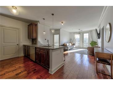 Open concept kitchen with island, stainless steel appliances, and granite countertops at 901 Abernathy Ne Rd # 5050, Atlanta, GA 30328