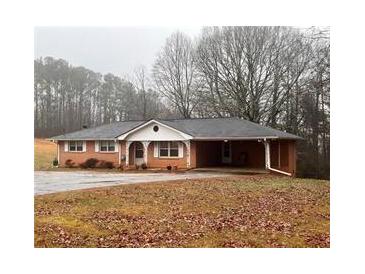 Brick ranch house with carport and large yard at 4890 Prince Se Rd, Smyrna, GA 30082
