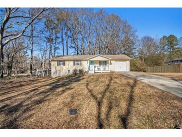 Ranch house with attached garage and a spacious yard at 219 Valerie Cir, Hiram, GA 30141