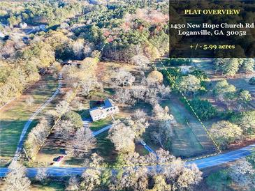 Aerial view of a house and 5.99 acres of land at 1430 New Hope Church Rd, Loganville, GA 30052