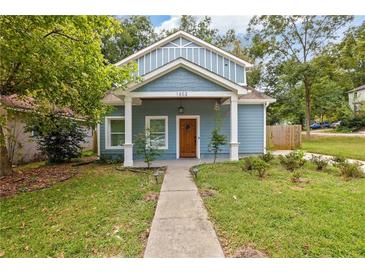 Charming craftsman style home with a welcoming front porch and landscaped yard at 1302 Ladd St, Atlanta, GA 30310