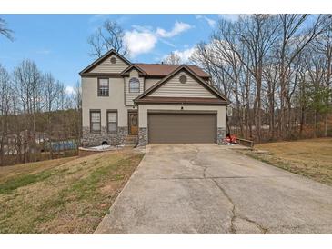 Charming two-story home featuring stone accents and a two-car garage at 148 Shady View Pl, Lawrenceville, GA 30044