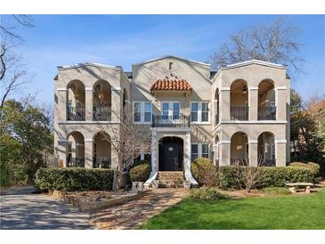 Attractive 3-story building with Spanish-style architecture and balconies at 856 Briarcliff Ne Rd # 25, Atlanta, GA 30306