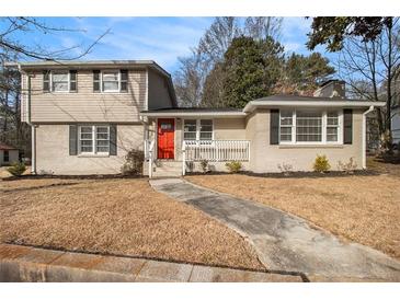 Two-story house with a red door and well-maintained lawn at 4079 Parks Ln, Douglasville, GA 30135