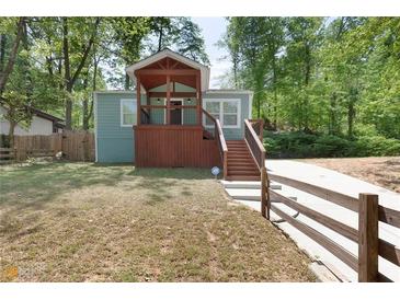 Newly renovated home with inviting front porch and landscaping at 1482 Andrews Nw St, Atlanta, GA 30314