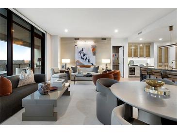 Bright, open living space features expansive windows and contemporary decor at 2520 Peachtree Nw Rd # 1202, Atlanta, GA 30305