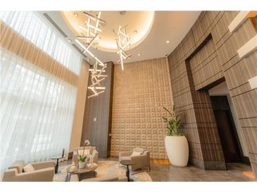 Elegant lobby with modern seating and large windows at 1080 Peachtree Ne St # 2710, Atlanta, GA 30309