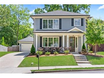 Two-story house with gray siding, white trim, and a landscaped lawn at 510 Oak Dr, Hapeville, GA 30354