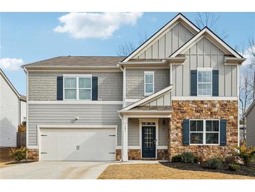 Charming two-story home with stone accents, a two-car garage, and beautiful curb appeal at 251 Ivy Chase Loop, Dallas, GA 30157