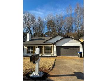 Newly renovated house with a charming front yard at 235 Prestwyck Oak, Lawrenceville, GA 30043