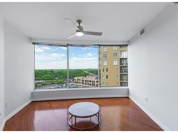 Bright living room with hardwood floors and city view at 3338 Peachtree Ne Rd # 1104, Atlanta, GA 30326