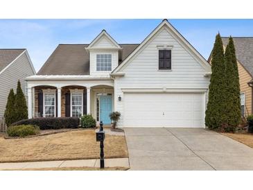 Charming two-story home with light blue front door and attached two-car garage at 1440 Vinery Ave, Cumming, GA 30041