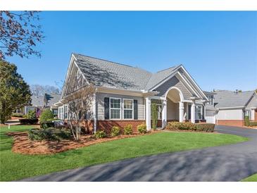 Ranch style home with brick accents and a covered porch at 2614 Grapevine Cir, Cumming, GA 30041