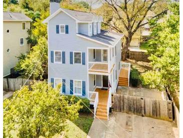 Two-story house with gray siding, multiple windows, and a deck at 673 Windsor Sw St, Atlanta, GA 30310