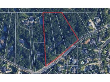 Aerial view showing a large lot of land near a road at 261 Mount Vernon Nw Hwy, Atlanta, GA 30328