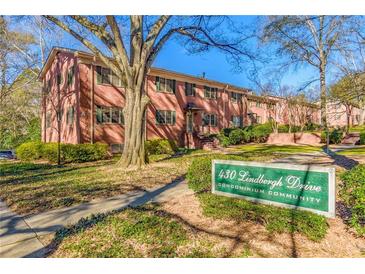 Brick condo building with landscaping and a welcoming entrance at 430 Lindbergh Ne Dr # A1, Atlanta, GA 30305