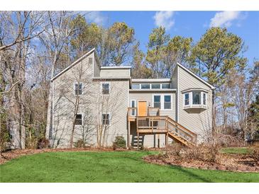 Two-story house with deck, attached garage, and landscaped yard at 2653 Forest Ne Way, Marietta, GA 30066