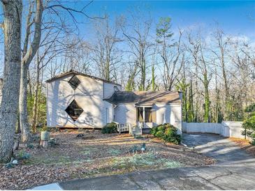 Two-story house with unique architectural details and woodsy setting at 2046 Kinridge Ct, Marietta, GA 30062