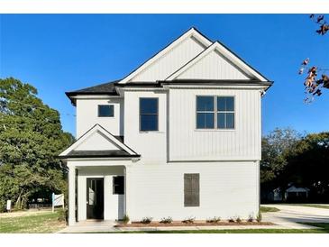 Two-story white house with black accents and a landscaped lawn at 111 Cassville-White, Cartersville, GA 30121