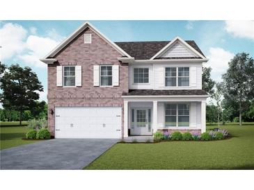 Two-story brick home with white accents and a two-car garage at 3807 Lockaby Way, Lawrenceville, GA 30044