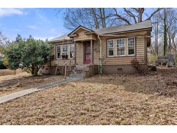 Quaint one-story house with a small front yard at 28 Gertrude Pl, Atlanta, GA 30318