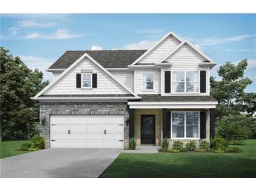 Two-story house with white siding, stone accents, and a three-car garage at 3686 Lockaby Way, Lawrenceville, GA 30044