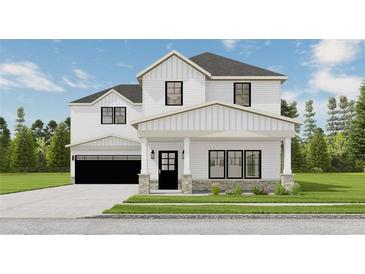 Two-story farmhouse with white siding, black windows, and a stone facade at 614 Charlotte Nw Pl, Atlanta, GA 30318