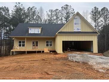 Craftsman style home with attached garage and front porch at 85 Presley Farm Parkway, Rockmart, GA 30153