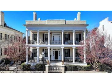 Grand two-story home with classic columns and a balcony at 3959 Saint Elisabeth Sq, Duluth, GA 30096