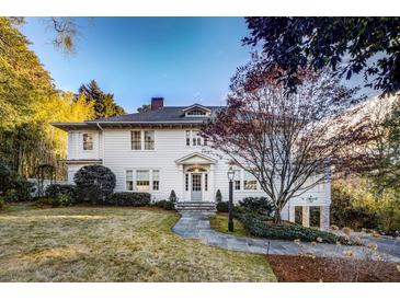 Charming two-story home with a beautifully landscaped lawn at 2583 Habersham Nw Rd, Atlanta, GA 30305