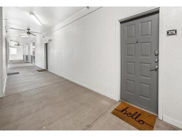 Bright hallway with modern gray door and concrete flooring at 821 Ralph Mcgill Ne Blvd # 3216, Atlanta, GA 30306