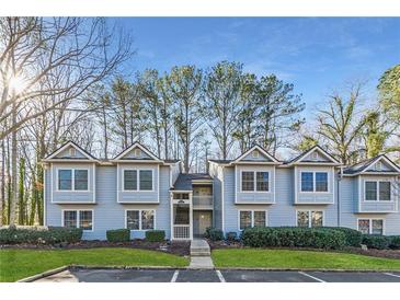 Inviting light blue townhome with landscaping and ample parking at 41 Doranne Se Ct, Smyrna, GA 30080