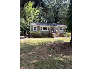 Ranch style home with a spacious yard and mature trees at 1228 Elizabeth Sw Ave, Atlanta, GA 30310