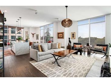 Spacious living room with hardwood floors, modern furniture, and large windows at 1820 Peachtree Nw St # 607, Atlanta, GA 30309