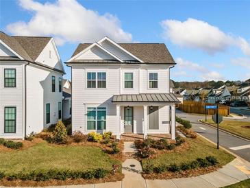 Two-story white house with gray door and brick walkway at 1026 Cagle Creek Overlook, Canton, GA 30115