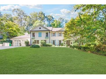 Beautiful two-story home with lush lawn and attached garage at 6110 Heards Creek Dr, Atlanta, GA 30328