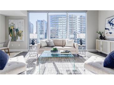Bright and airy living room with floor to ceiling windows and modern furnishings at 20 10Th Nw St # 901, Atlanta, GA 30309