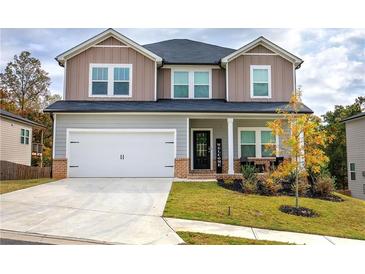 Two-story house with gray siding, white trim, and a brick front porch at 419 Murphy Ave, Canton, GA 30114