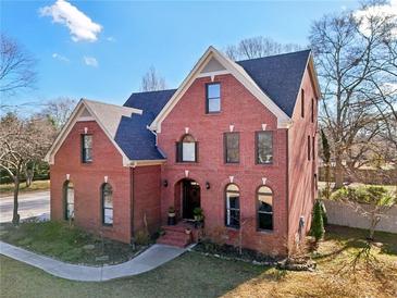 Brick two-story house with a landscaped yard at 632 Graymont Dr, Grayson, GA 30017