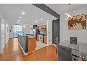 Modern kitchen with stainless steel appliances and granite countertops at 3040 Peachtree Rd # 614, Atlanta, GA 30305