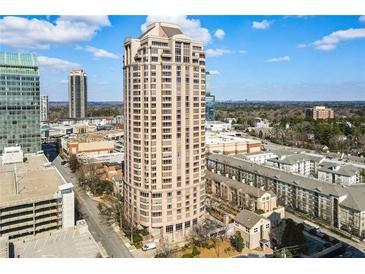 A high-rise residential building stands tall in this exterior daytime shot with lots of other buildings surrounding it at 3475 Oak Valley Ne Rd # 1930, Atlanta, GA 30326