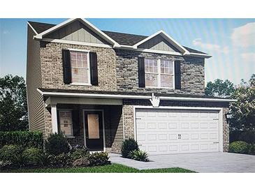 Two-story house with brick accents and a two-car garage at 417 Samara Ct, Fairburn, GA 30213