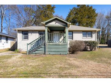 Charming one-story home with a inviting front porch and classic architectural design at 1770 Rockland Se Dr, Atlanta, GA 30316