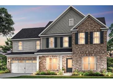 Two-story brick home with gray shake siding and a three-car garage at 5270 Birch Valley Rd, Cumming, GA 30028