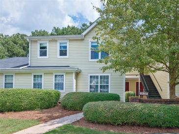Attractive exterior of a two-story townhome with landscaping at 23 Chelsea Ct, Avondale Estates, GA 30002