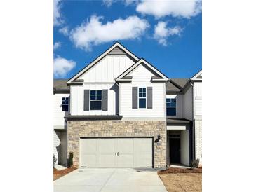 Charming townhouse featuring stone accents and gray shutters at 2458 Bayberry St, Acworth, GA 30101