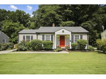 Charming craftsman home with a red door and well-manicured lawn at 1385 Kenilworth Sw Dr, Atlanta, GA 30310