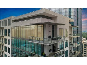 Modern condo building with glass balconies and city views at 40 12Th Ne St # 1903, Atlanta, GA 30309