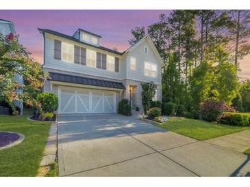 Two-story home with a large front yard and attached garage at 510 Kentwood Rd, Woodstock, GA 30188