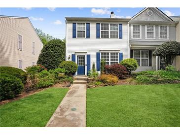 Charming townhome with well-manicured lawn and colorful landscaping at 3742 Berkeley Xing, Duluth, GA 30096